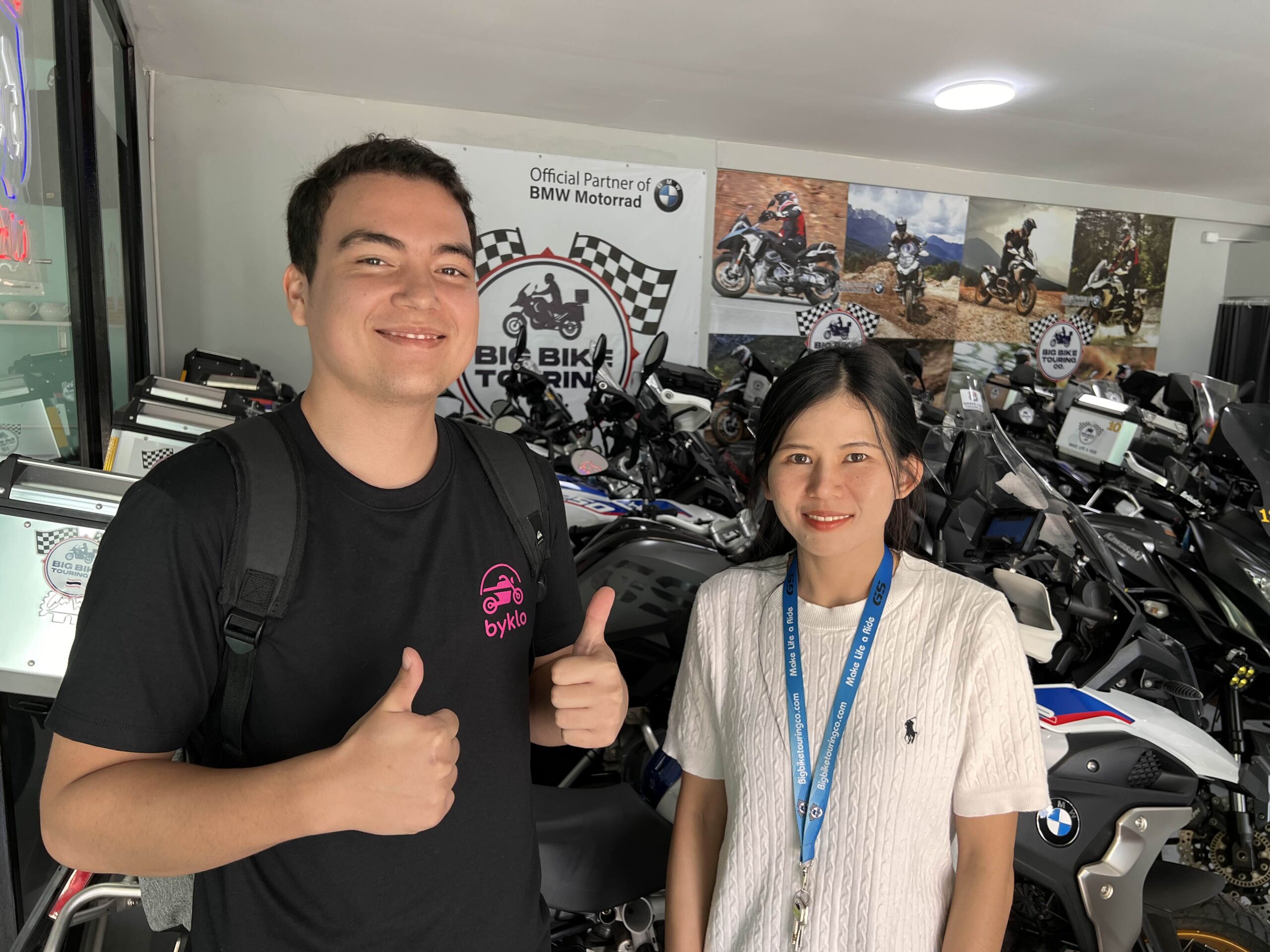 Big Bike Touring Chiang Mai Joins Byklo: Your Trusted Motorbike Rental In Chiang Mai! Byklo employee with rental shop owner standing inside motorbike rental shop Big Bike Touring Chiang Mai.