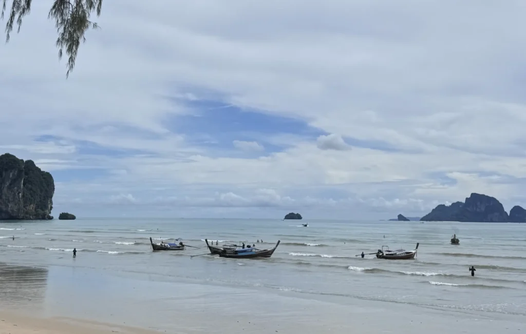 Boats by ao nang beach waiting on customers to head out to islands in Krabi