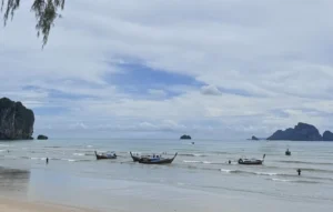 Boats by ao nang beach waiting on customers to head out to islands in Krabi