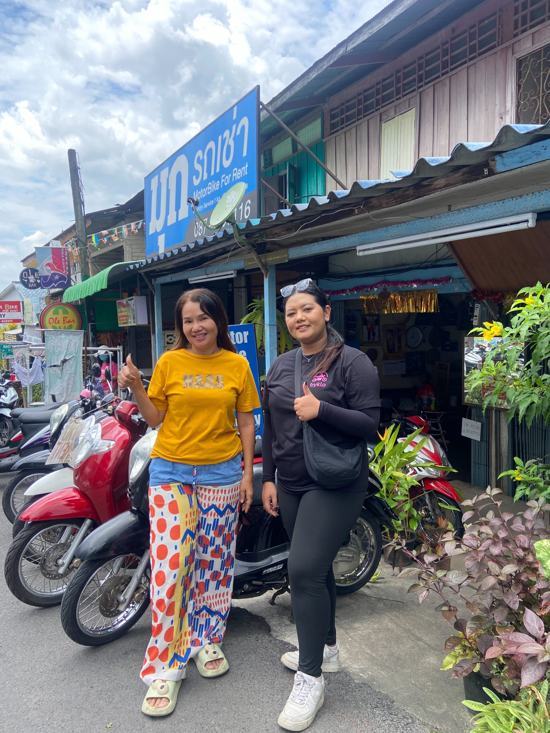Mook Motorbike for Rent Joins Byklo: Your Top-Rated Rental Shop in Krabi Town Mook motorbike For rent, Krabi Town. Owner standing outside shop with Byklo employee.