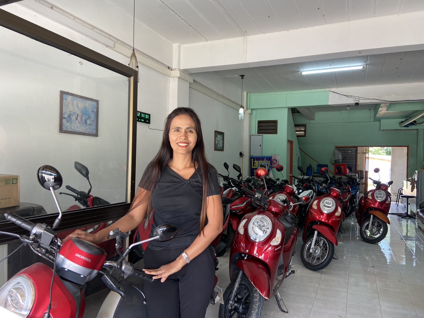 POR Motorbike For Rent Joins Byklo: Your Trusted Rental Shop in Koh Lanta POR Motorbike For Rent. Owner stading inside shop after signing with Byklo.rent