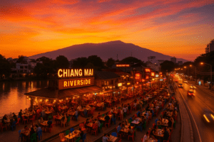Vibrant sunset over Chiang Mai riverside bars showcasing lively nightlife