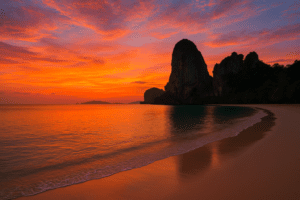 Sunset at Railay Beach with limestone cliffs in Krabi, Thailand