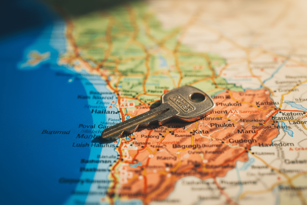 Scenic coastal view of Phuket with a parked scooter and beach in the background
